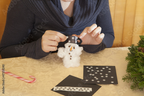 Photo: Making cotton-wool snowman-selective focus on snowman Making cotton-wool snowman-selective focus on snowman