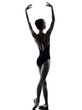 Photo: young woman ballerina ballet dancer stretching warming up young woman ballerina ballet dancer stretching warming up