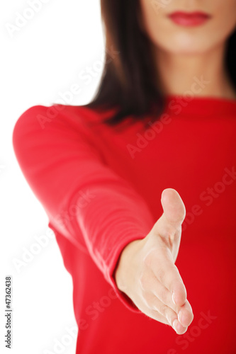 Photo: Adult woman about to shake hands. Adult woman about to shake hands.