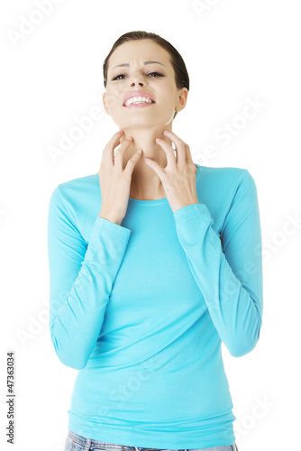 Photo: Young beautiful woman scraching her self. Young beautiful woman scraching her self.