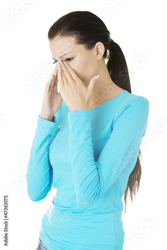 Photo: Young woman with sinus pressure pain Young woman with sinus pressure pain