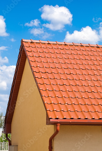 Photo: red roof with blue sky red roof with blue sky
