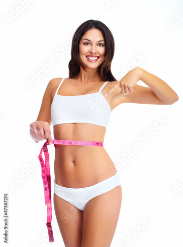Photo: Beautiful healthy woman with a measuring tape. Beautiful healthy woman with a measuring tape.