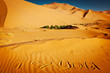 Words "I love you" written in the sand dunes