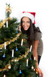 Attractive Santa Girl with Xmas / Christmas Tree