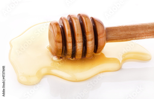 Photo: Wooden honey dipper and Honey Wooden honey dipper and Honey