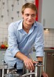 Photo: Handsome man cooking in the kitchen Handsome man cooking in the kitchen