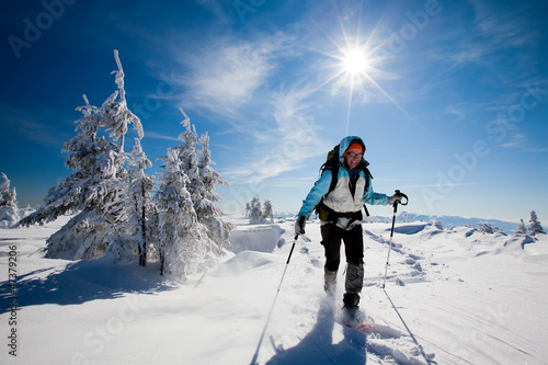 Photo: Hiker in winter mountains snowshoeing Hiker in winter mountains snowshoeing