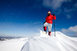 Hiker in winter mountains snowshoeing