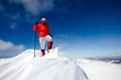 Hiker in winter mountains snowshoeing