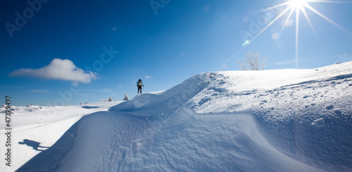 Photo: Hiker in winter mountains Hiker in winter mountains