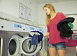 Woman in a laundromat shop.