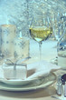 Festive dinner setting with gift for the holidays