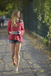 Young woman with map walking