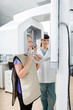 Photo: Female Dentist With Patient Getting Her Teeth X-Rayed At Clinic Female Dentist With Patient Getting Her Teeth X-Rayed At Clinic