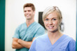 Photo: Young Female Vet In Scrubs Smiling Young Female Vet In Scrubs Smiling
