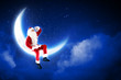 photo of santa claus sitting on the moon