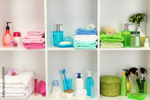 Photo: Bath accessories on shelfs in bathroom Bath accessories on shelfs in bathroom