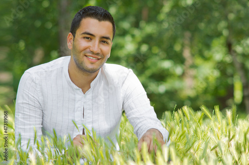 Photo: Portrait of relaxing man in a summer day-SMALL DOF Portrait of relaxing man in a summer day-SMALL DOF