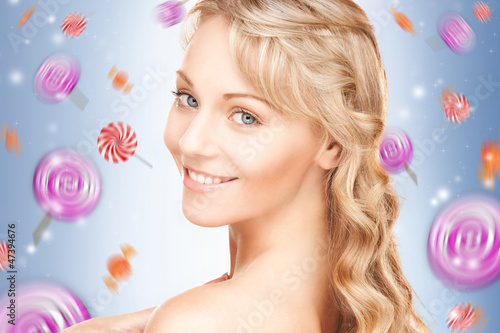 Photo: happy teenage girl with lollipops happy teenage girl with lollipops
