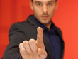 handsome man in suit pressing virtual button