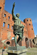 statue of roman imperor on front of porta palatina