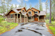 Mountain luxury home with stone and wood exterior.