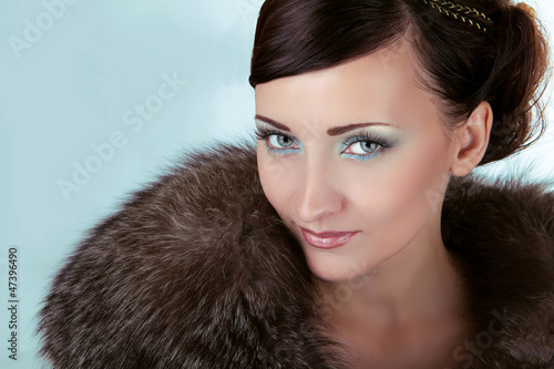Photo: Woman with blue eyes, Winter Girl in Luxury Fur Coat Woman with blue eyes, Winter Girl in Luxury Fur Coat