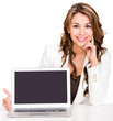 Businesswoman showing a laptop screen
