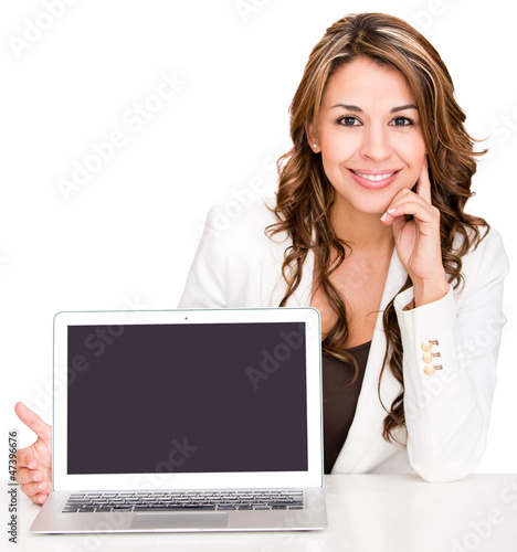Photo: Businesswoman showing a laptop screen Businesswoman showing a laptop screen