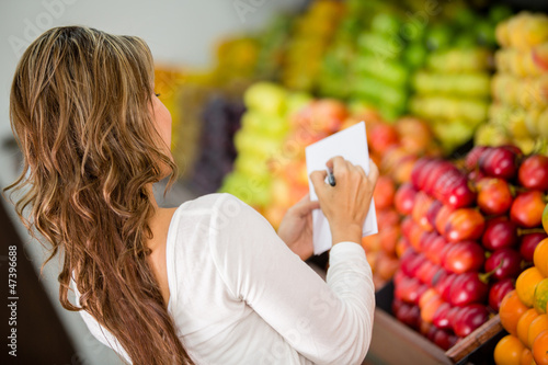 Photo: Woman with a shopping list Woman with a shopping list