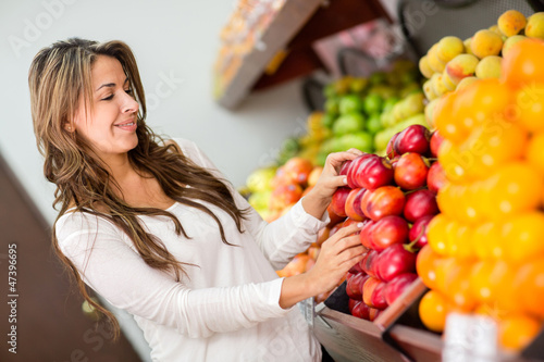 Photo: Woman buying fruits at the supermarket Woman buying fruits at the supermarket