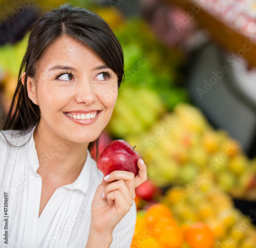Photo: Woman buying groceries Woman buying groceries