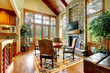 Photo: Luxury mountain home diining and living room with fireplace. Luxury mountain home diining and living room with fireplace.