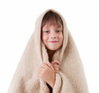 Little girl is basking under a blanket
