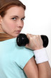 Woman lifting a dumbbell