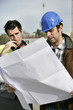 Foreman and colleague checking over plans