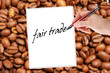 coffee beans with hand writes fair trade