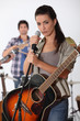 pretty brunette singing with band