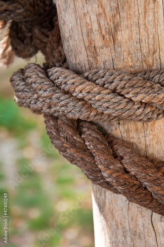 Photo: Ship rope and weathered wood background Ship rope and weathered wood background