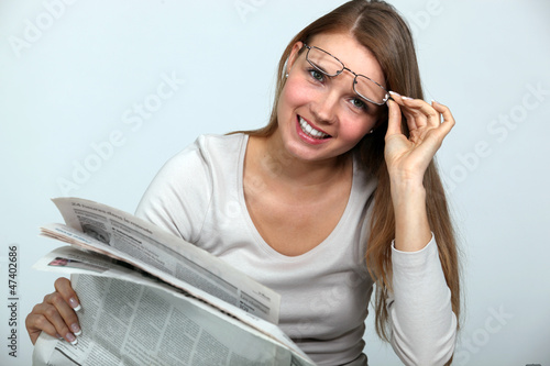 Photo: Woman reading the newspaper. Woman reading the newspaper.