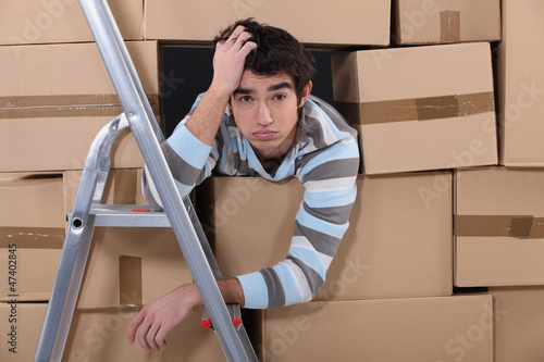 Photo: Stressed young factory worker Stressed young factory worker