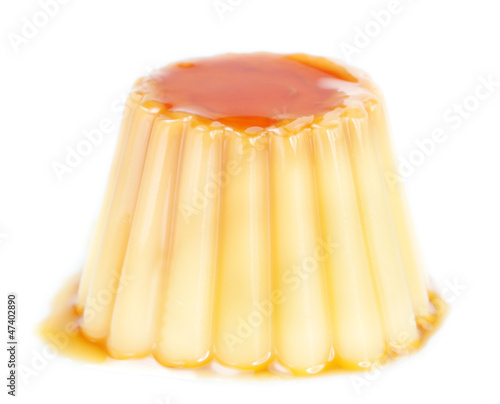 Photo: Delicious yogurt pudding with caramel. On a white background. Delicious yogurt pudding with caramel. On a white background.