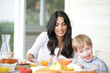 Photo: Mother and son at breakfast Mother and son at breakfast
