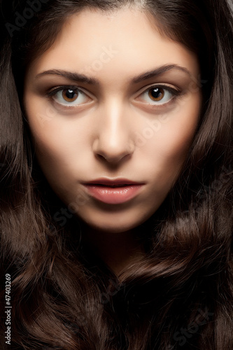 Photo: Close up portrait of beautiful woman face Close up portrait of beautiful woman face