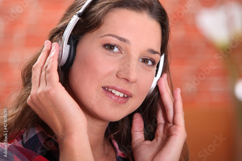 Photo: Brunette with headphones Brunette with headphones