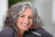 Photo: Close-up of grey haired woman at home Close-up of grey haired woman at home