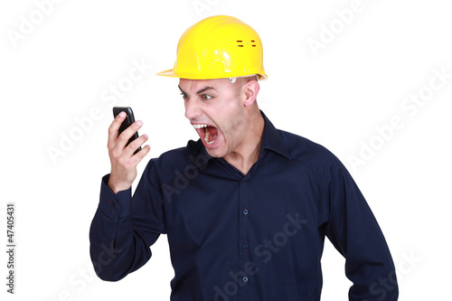 Photo: An architect yelling at his phone. An architect yelling at his phone.