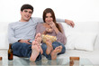 Photo: Young couple on a sofa Young couple on a sofa
