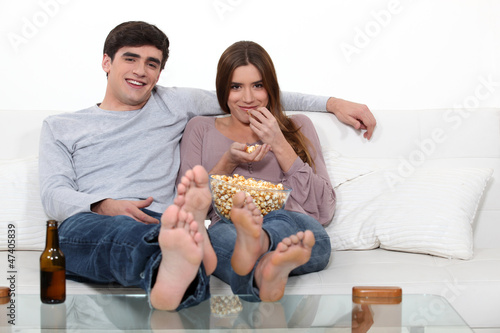 Photo: Young couple on a sofa Young couple on a sofa